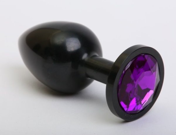 Черная анальная пробка с фиолетовым стразом - 7,6 см