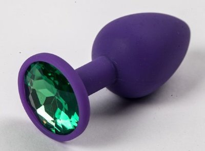 Фиолетовая силиконовая анальная пробка с зеленым стразом - 7,1 см