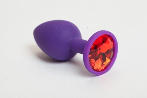 Фиолетовая силиконовая анальная пробка с красным стразом - 7,1 см