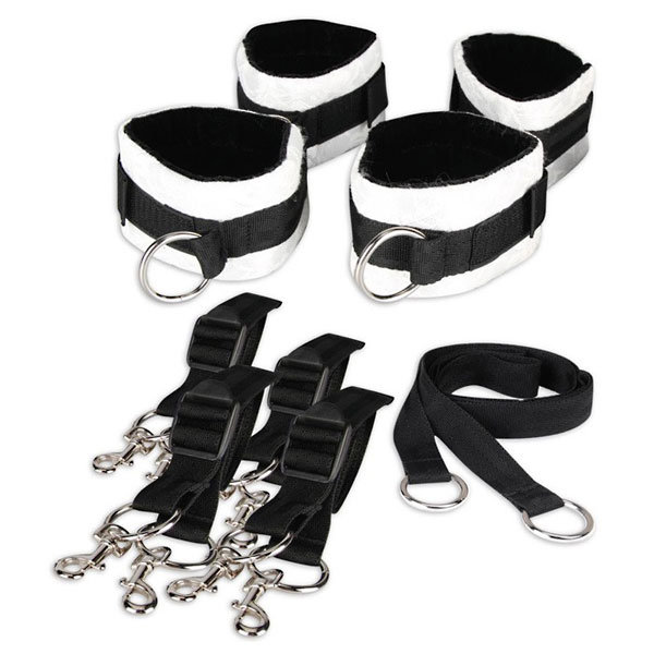 Две пары черно-белых кружевных наручников, крепящиеся к матрасу